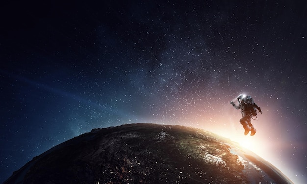 Astronaut At Spacewalk On Planet Orbit  32066713